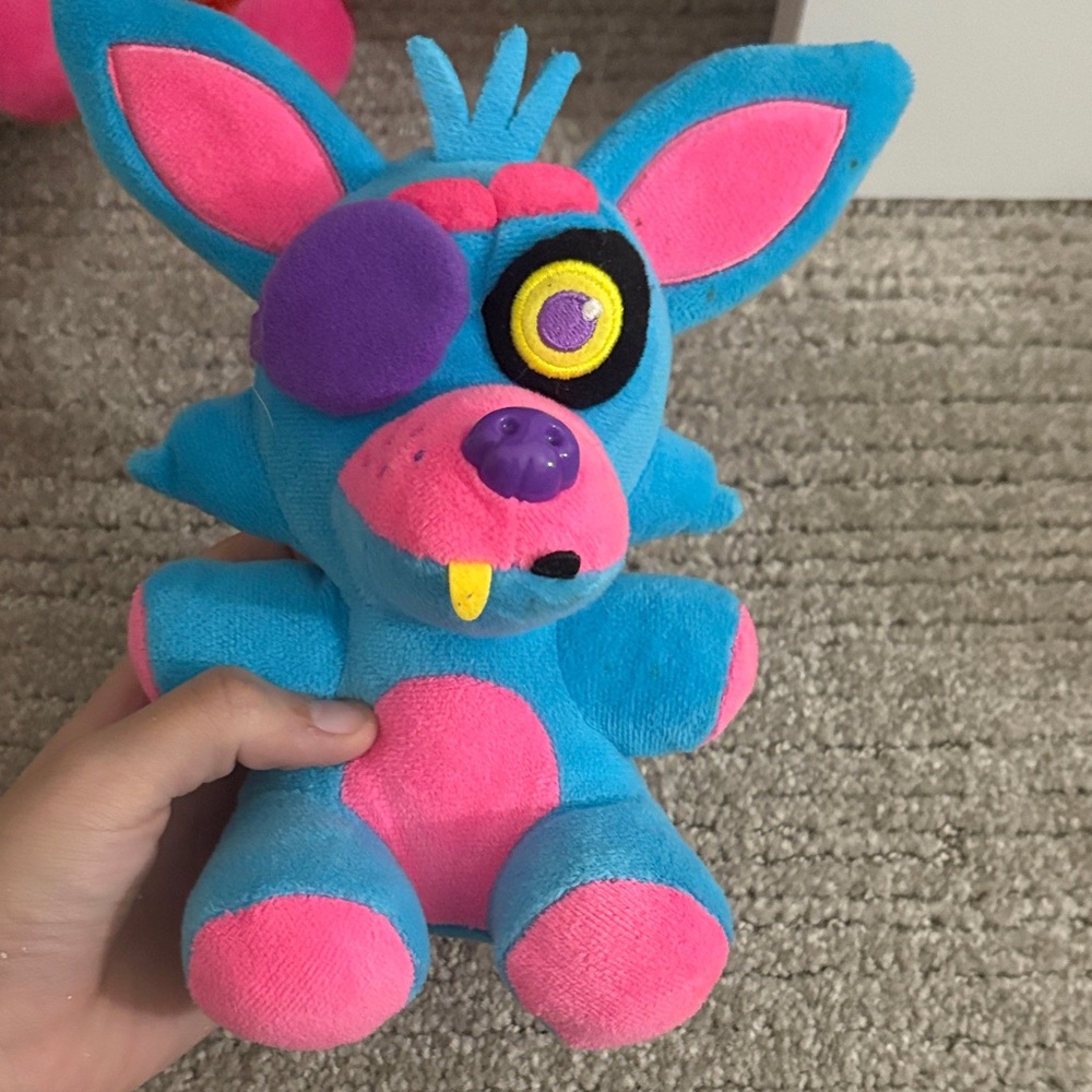 Blue and Pink Plush Toy with Eye Patch
